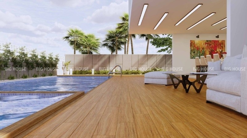 Sân bể bơi nhà biệt thự hiện đại lát nền gạch giả gỗ vàng Sân bể bơi nhà biệt thự hiện đại lát nền gạch giả gỗ vàng